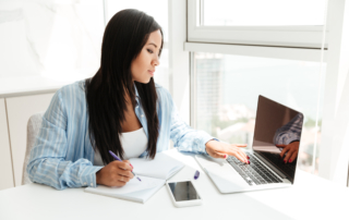 Woman working on laptop in office