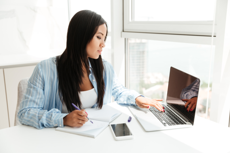 Woman working on laptop in office